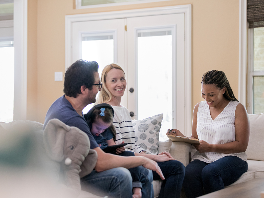 social worker meeting with family in their home