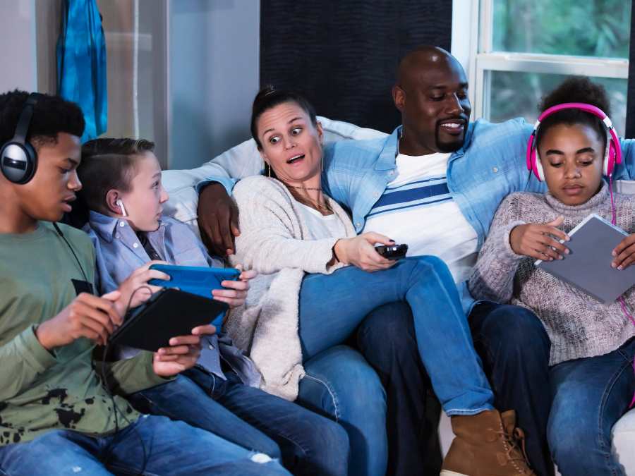 Family sitting on a couch.